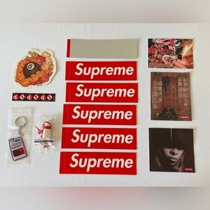 Collectible Supreme items, parachute toy, jug keychain, and 19 various stickers